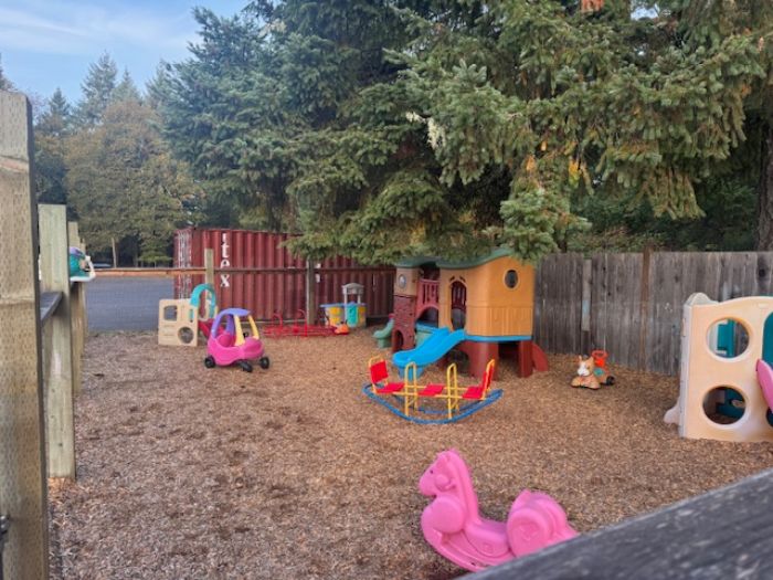 Teacher and preschool student working